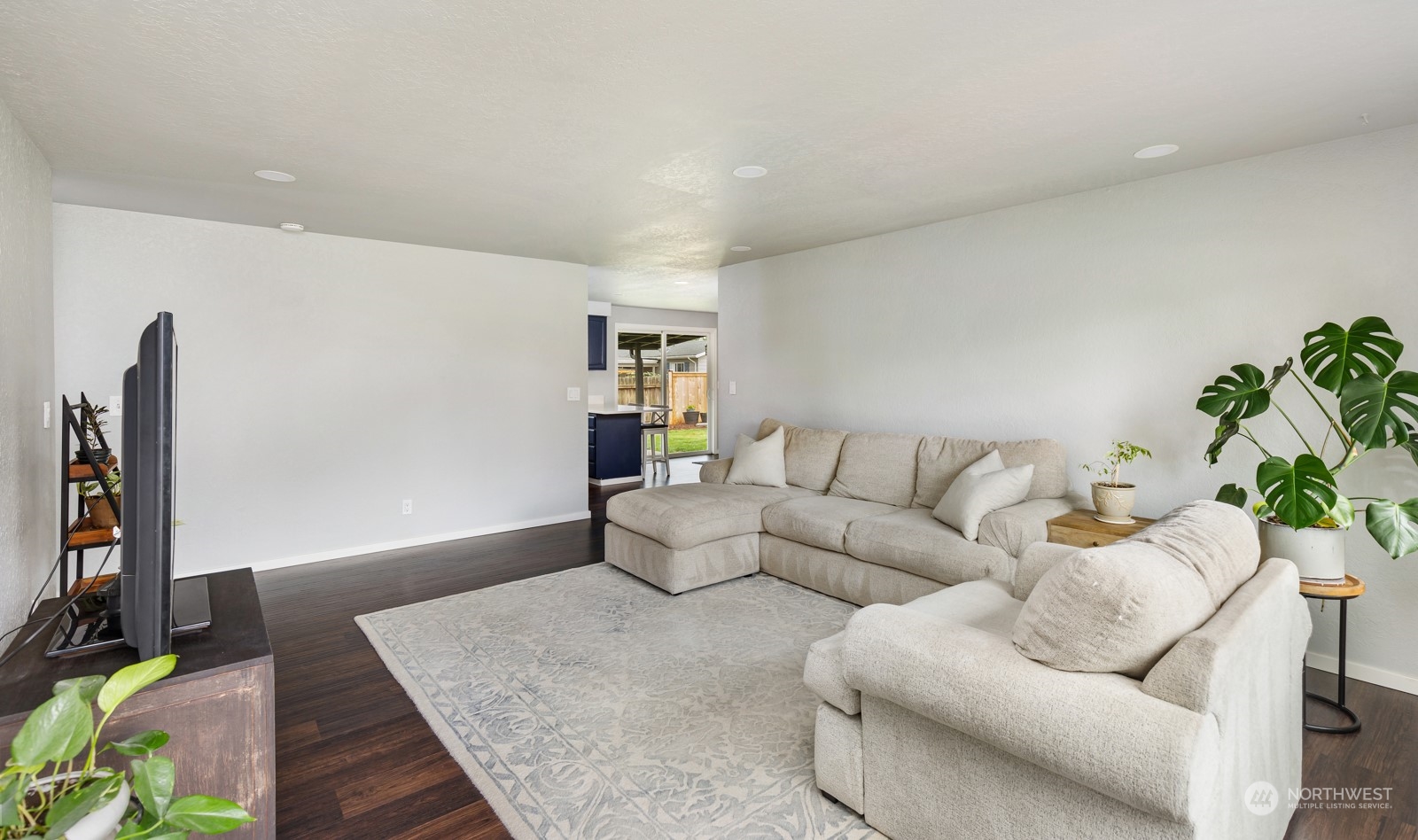827 Natalie Place Enumclaw, WA 98022 - Photo 3 of 18 a living room with furniture and a flat screen tv