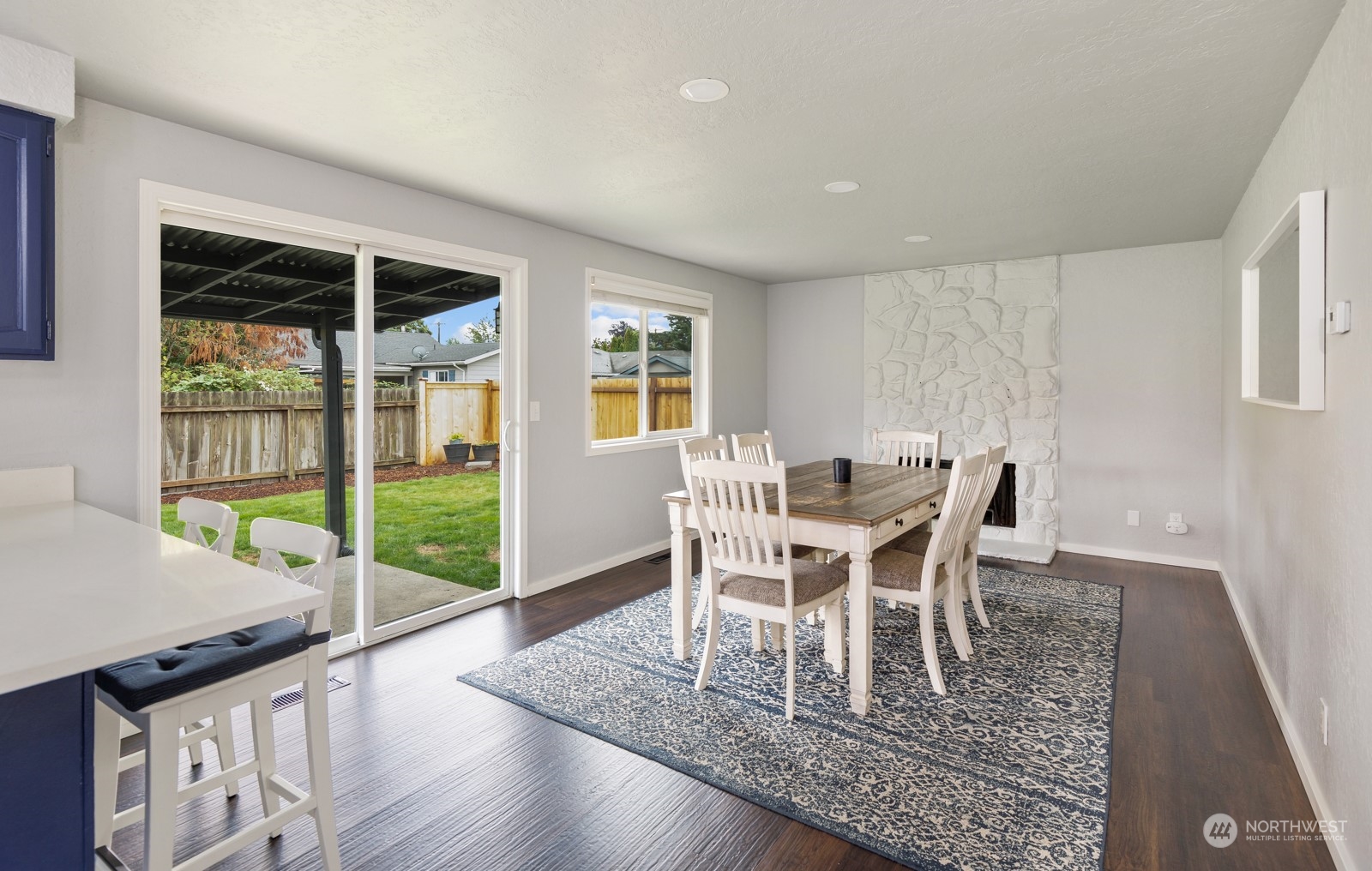 827 Natalie Place Enumclaw, WA 98022 - Photo 8 of 18 a dining room with furniture and wooden floor