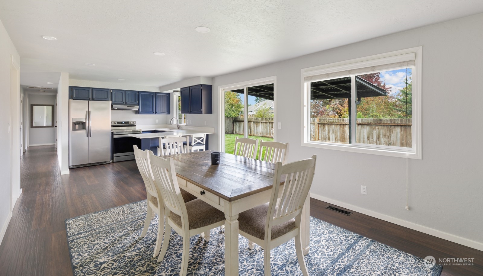 827 Natalie Place Enumclaw, WA 98022 - Photo 9 of 18 a view of a dining room with furniture window and wooden floor