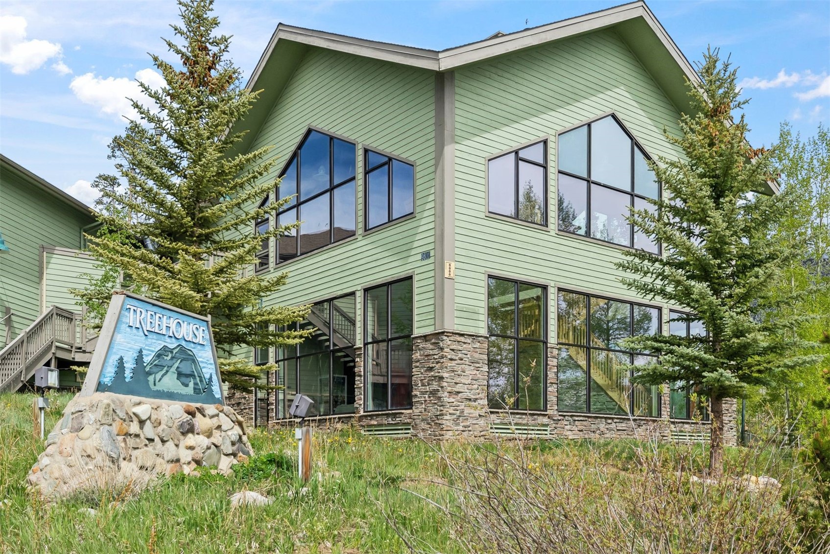 8100 Ryan Gulch Road, Unit 106 Wildernest, CO 80498 - Photo 31 of 43 a view of a house with a yard