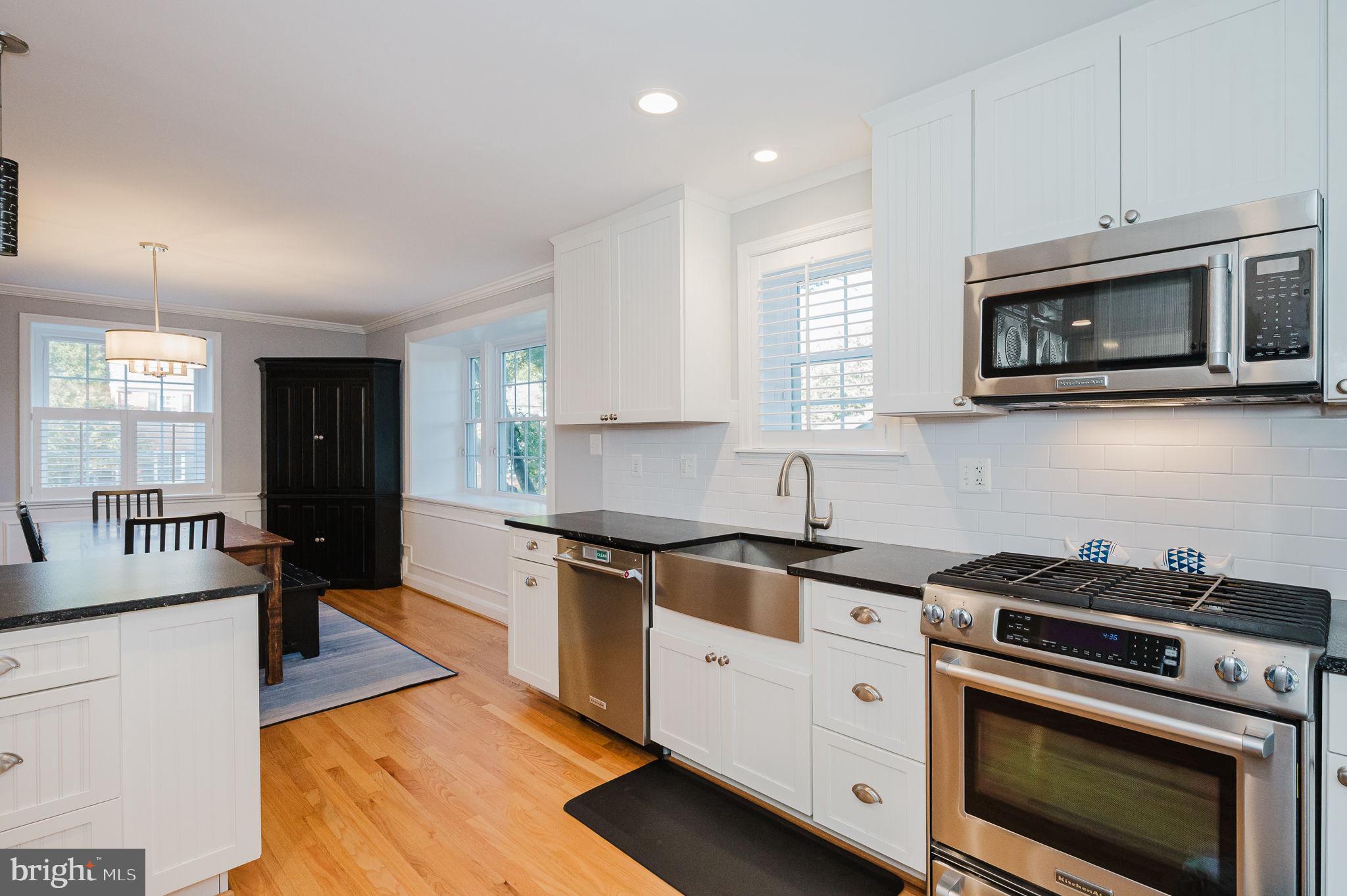 625 Yarmouth Road Towson, MD 21286 - Photo 11 of 69 a kitchen with stainless steel appliances granite countertop a stove microwave and cabinets