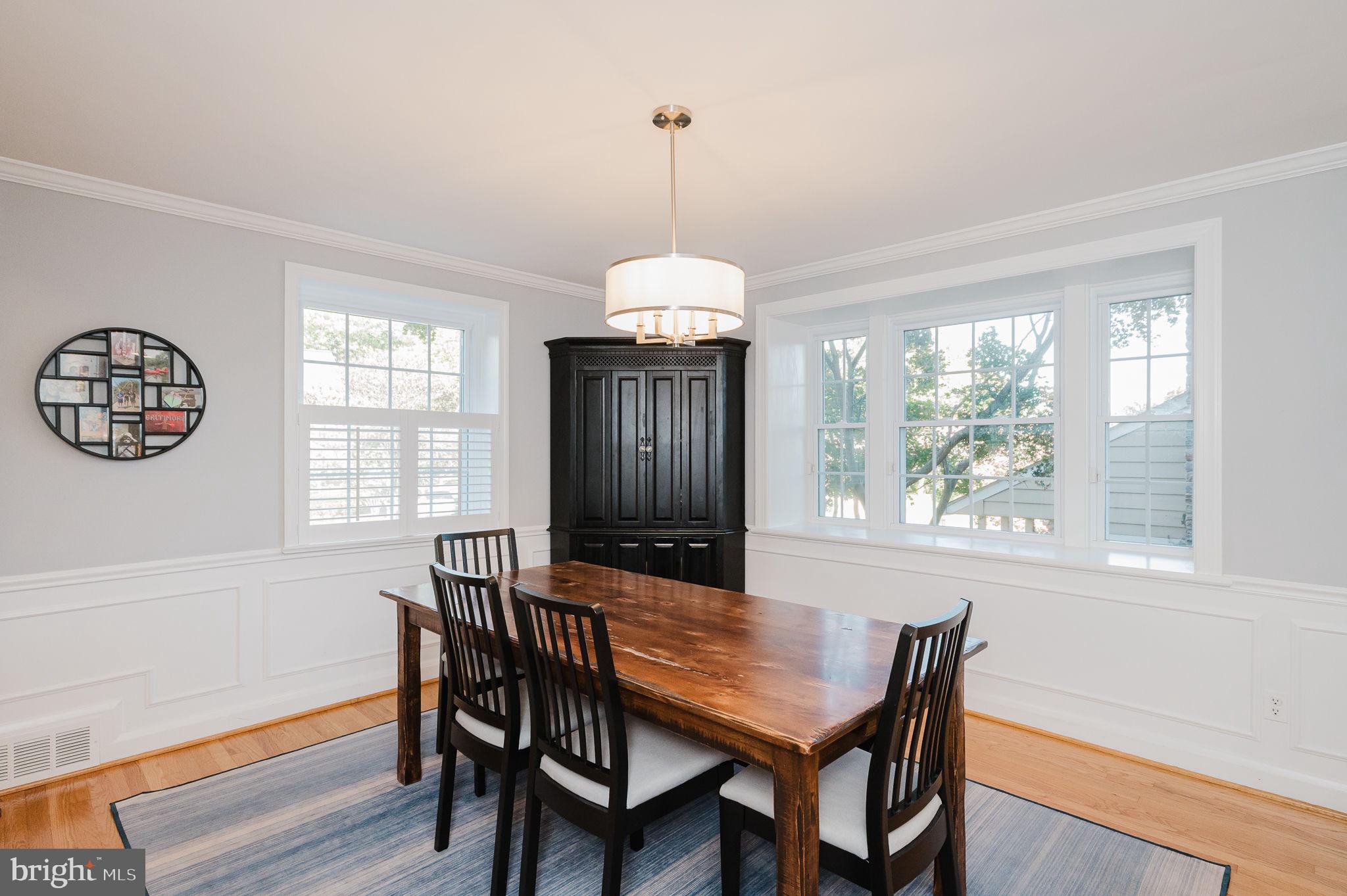 625 Yarmouth Road Towson, MD 21286 - Photo 17 of 69 a dining room with furniture a chandelier and wooden floor