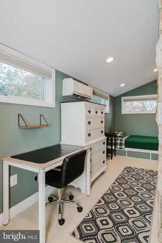 a room with furniture and a book shelf