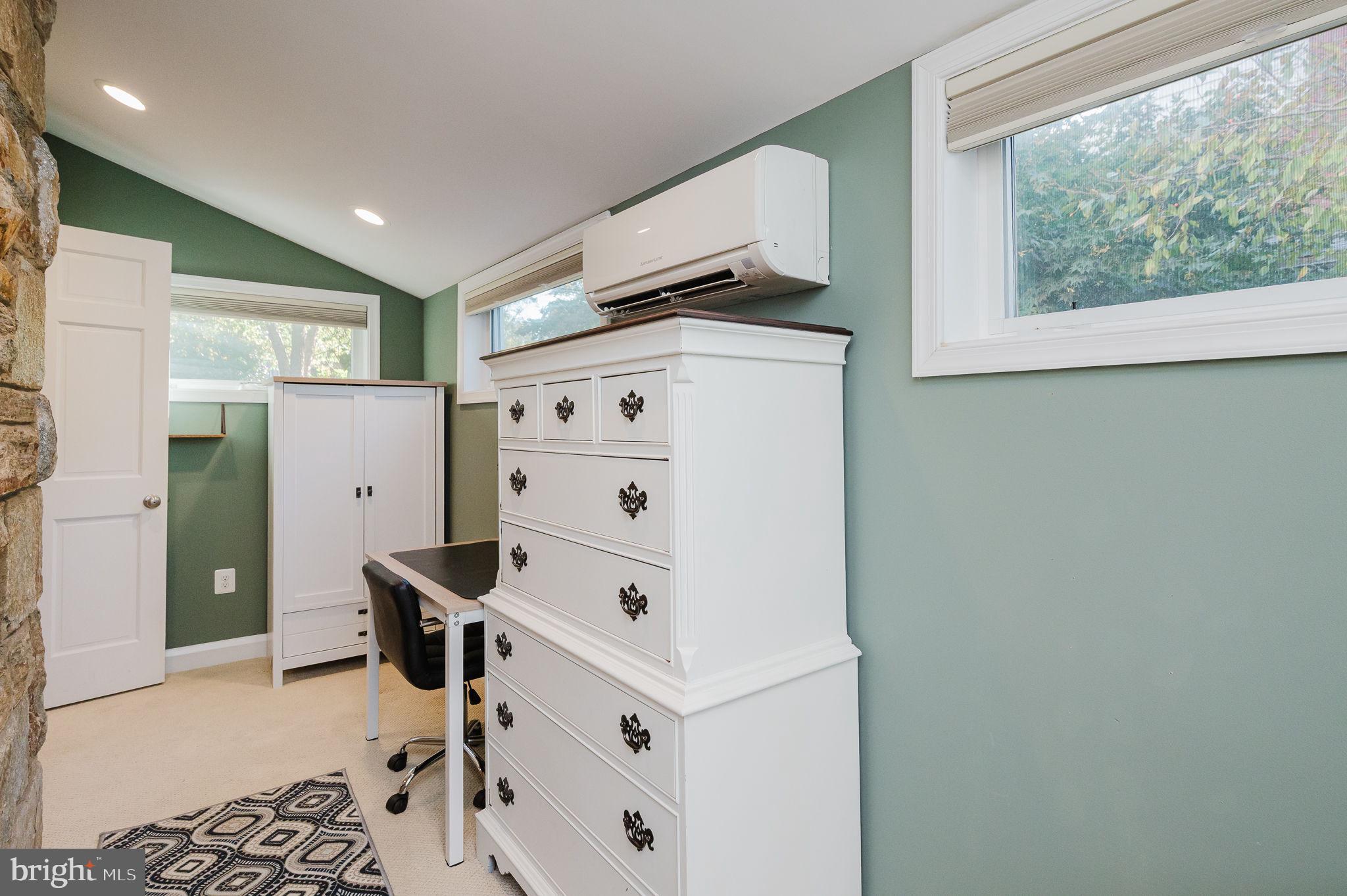 625 Yarmouth Road Towson, MD 21286 - Photo 23 of 69 a room with furniture a clock on wall and a window
