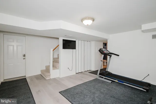 a view of backyard with deck and garden