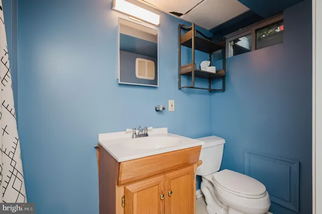 a swimming pool with outdoor seating and yard