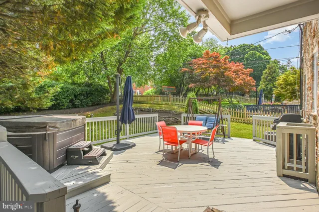 a view of a park with iron fence