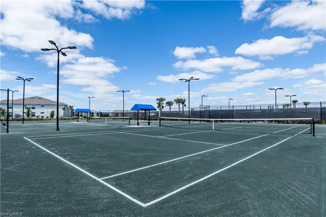 a kitchen with stainless steel appliances a refrigerator sink and microwave