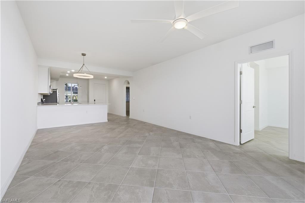 5555 Double Eagle Circle, Unit 3915 Ave Maria, FL 34142 - Photo 16 of 33 a view of a kitchen with a sink and cabinets