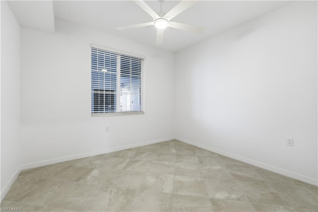 5555 Double Eagle Circle, Unit 3915 Ave Maria, FL 34142 - Photo 18 of 33 an empty room with a window