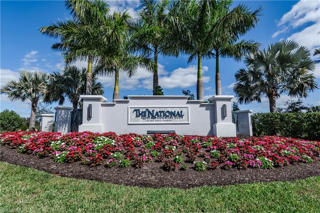 5555 Double Eagle Circle, Unit 3915 Ave Maria, FL 34142 - Photo 2 of 33 a view of sign board with flower in front of main door