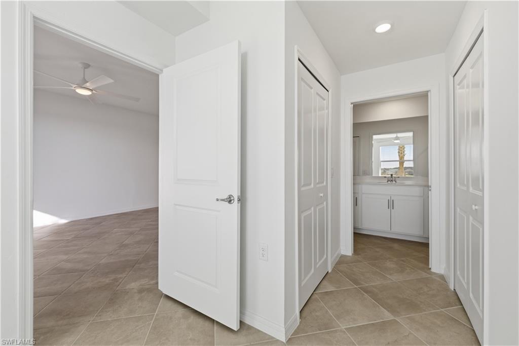 5555 Double Eagle Circle, Unit 3915 Ave Maria, FL 34142 - Photo 22 of 33 a view of a hallway with closet and a bathroom