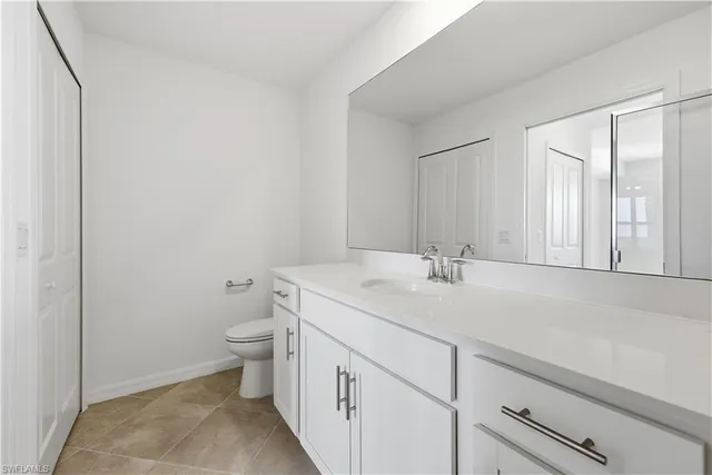 a front view of a house with lots of yellow lighting on it