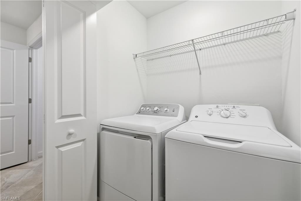 5555 Double Eagle Circle, Unit 3915 Ave Maria, FL 34142 - Photo 25 of 33 a utility room with dryer and washer