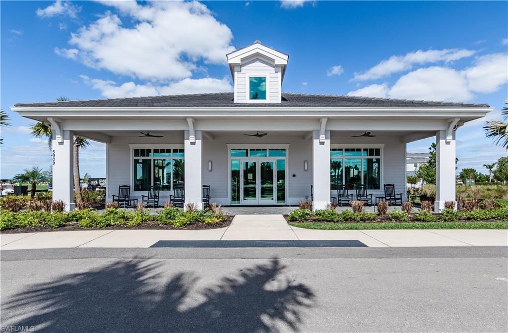 5555 Double Eagle Circle, Unit 3915 Ave Maria, FL 34142 - Photo 26 of 33 a front view of a house with lots of yellow lighting on it