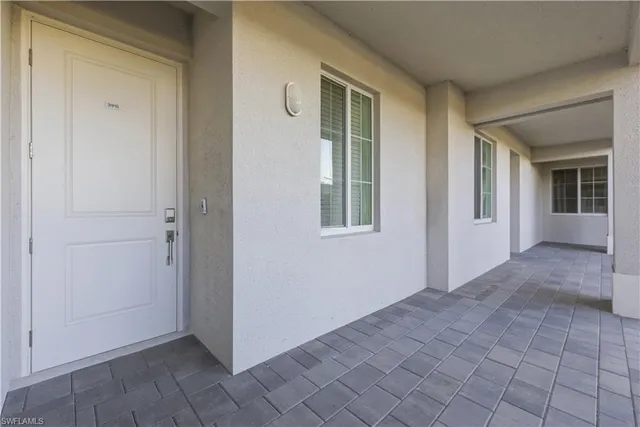 a kitchen with a sink stove top oven and cabinets