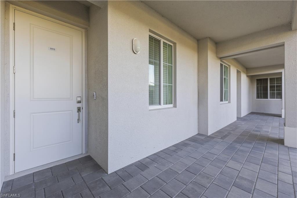 5555 Double Eagle Circle, Unit 3915 Ave Maria, FL 34142 - Photo 10 of 33 an empty room with windows