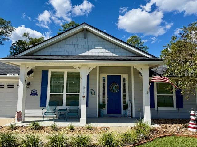 86351 Moonlit Walk Circle Yulee, FL 32097 - Photo 2 of 53 front view of a house with a yard