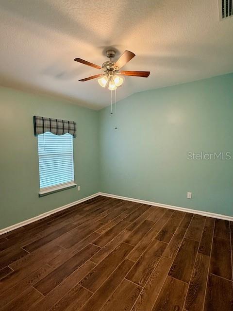 86351 Moonlit Walk Circle Yulee, FL 32097 - Photo 32 of 53 an empty room with wooden floor closet and ceiling fan