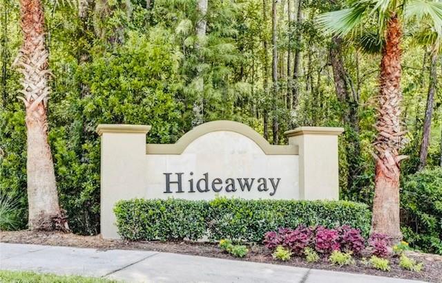 86351 Moonlit Walk Circle Yulee, FL 32097 - Photo 49 of 53 a sign that is sitting in front of flowers