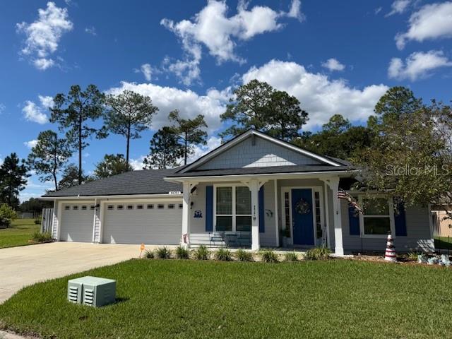 86351 Moonlit Walk Circle Yulee, FL 32097 - Photo 6 of 53 front view of a house with a yard