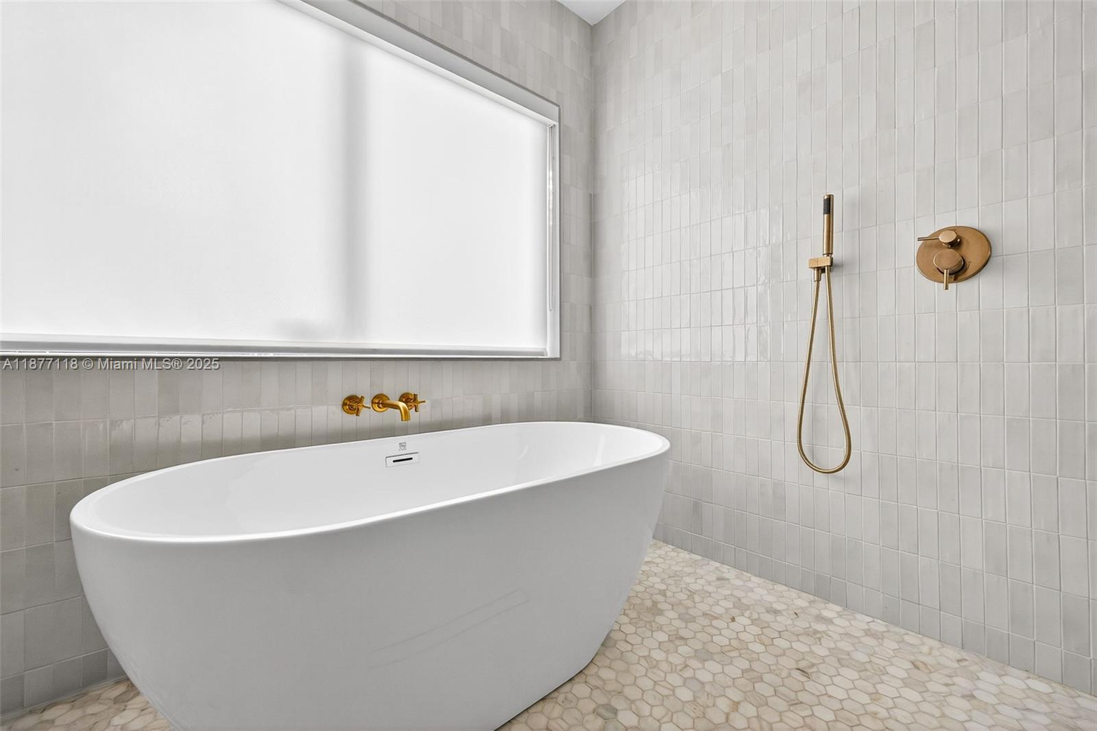 635 Bird Road Coral Gables, FL 33146 - Photo 15 of 25 a bathroom with a bathtub and shower