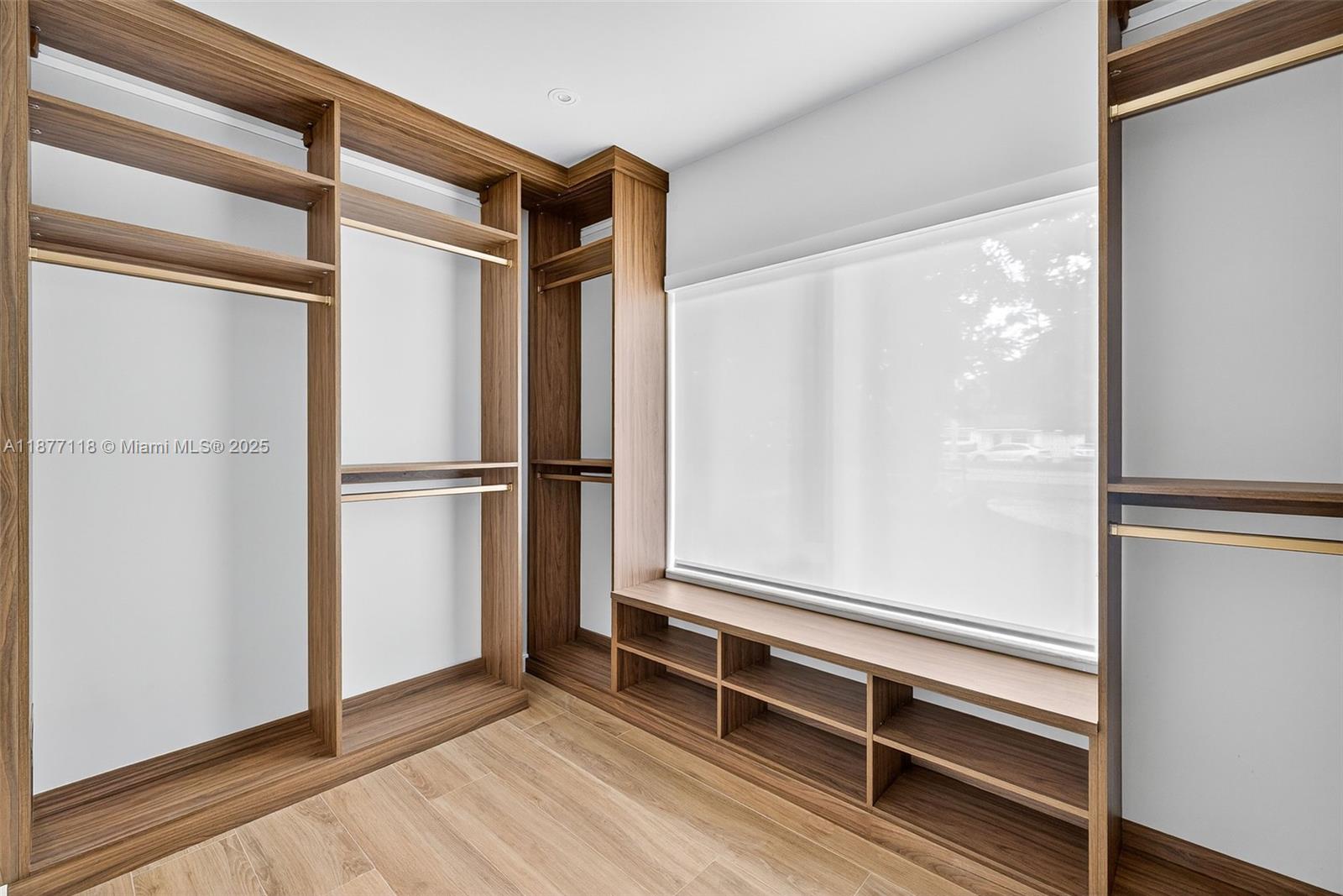 635 Bird Road Coral Gables, FL 33146 - Photo 16 of 25 a empty room with wooden floor and a window