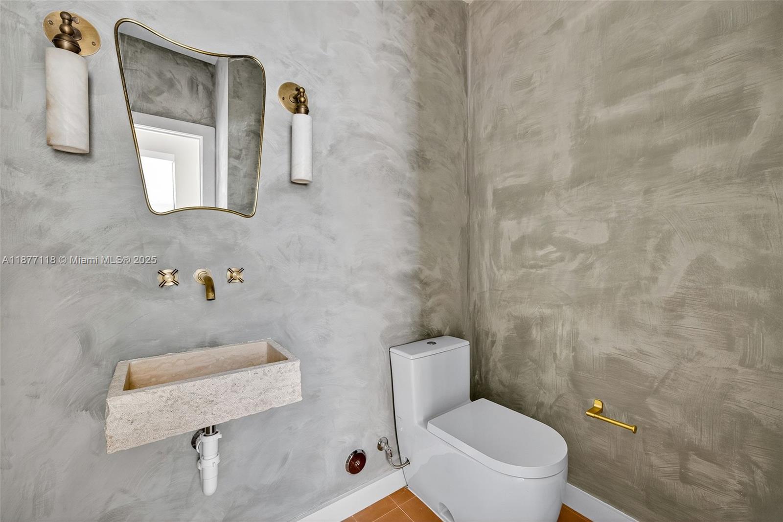 635 Bird Road Coral Gables, FL 33146 - Photo 18 of 25 a white toilet sitting next to a bathroom sink