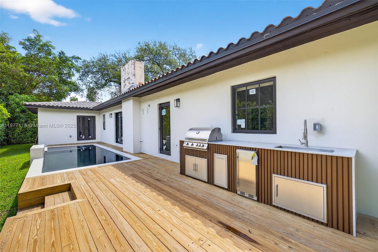 635 Bird Road Coral Gables, FL 33146 - Photo 22 of 25 a view of balcony with deck and wooden floor