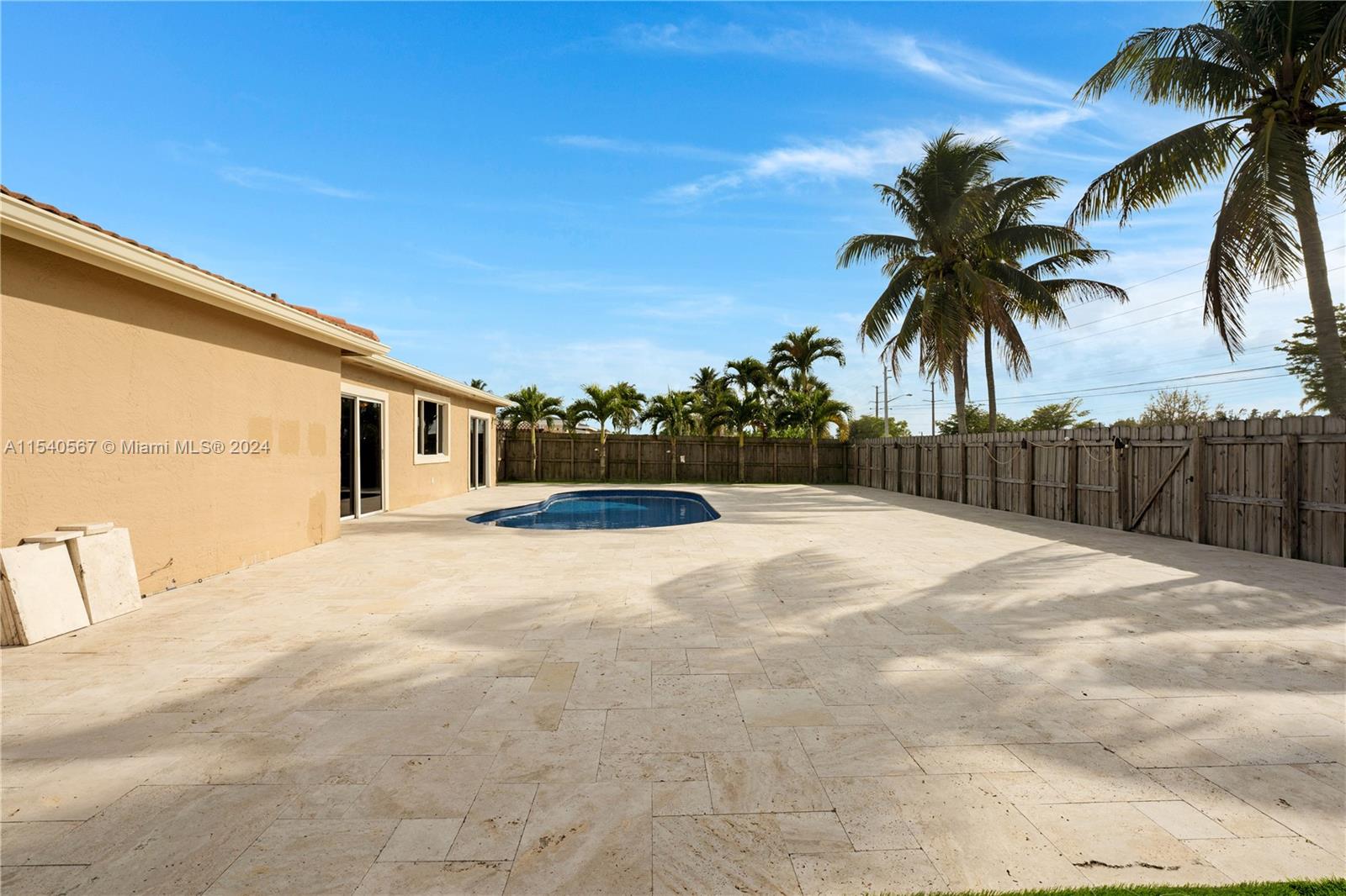 22305 General Street Boca Raton, FL 33428 - Photo 26 of 40 a view of swimming pool with a yard