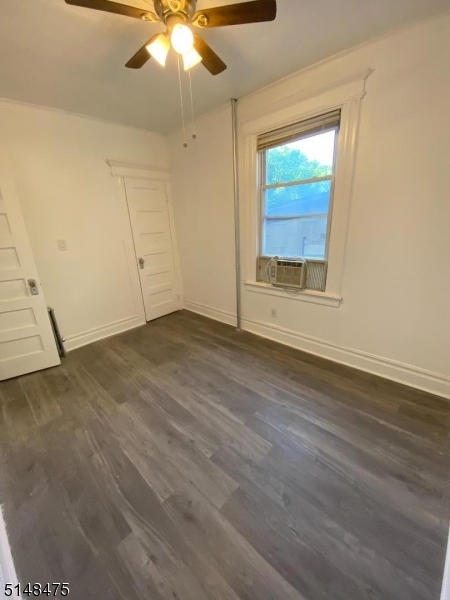 46 Prospect Street, Unit 2 Bloomfield, NJ 07003 - Photo 17 of 33 an empty room with wooden floor fan and windows