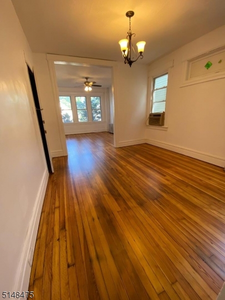 46 Prospect Street, Unit 2 Bloomfield, NJ 07003 - Photo 2 of 33 wooden floor in an empty room with a window