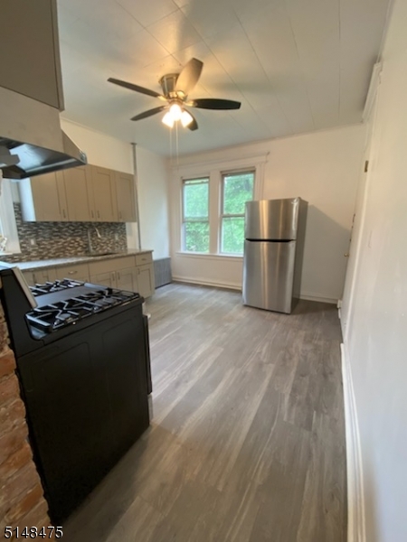 46 Prospect Street, Unit 2 Bloomfield, NJ 07003 - Photo 23 of 33 a kitchen with a stove a refrigerator and a microwave