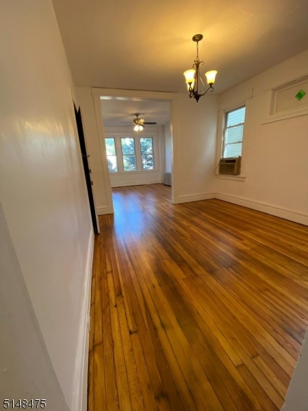 46 Prospect Street, Unit 2 Bloomfield, NJ 07003 - Photo 27 of 33 wooden floor in an empty room with a window