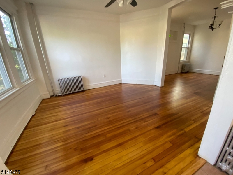 46 Prospect Street, Unit 2 Bloomfield, NJ 07003 - Photo 3 of 33 a view of a room with wooden floor and staircase