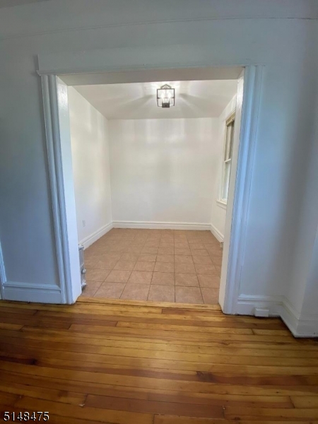 46 Prospect Street, Unit 2 Bloomfield, NJ 07003 - Photo 31 of 33 a view of empty room with wooden floor