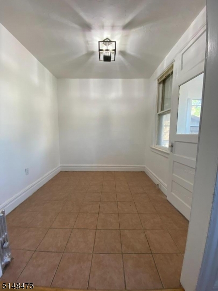 46 Prospect Street, Unit 2 Bloomfield, NJ 07003 - Photo 4 of 33 a view of an empty room with a window