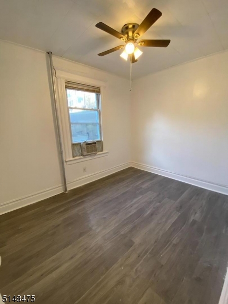 46 Prospect Street, Unit 2 Bloomfield, NJ 07003 - Photo 8 of 33 an empty room with wooden floor fan and windows
