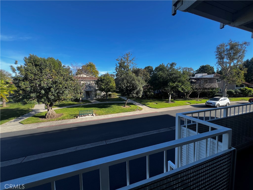 863 Ronda Mendoza, Unit B Laguna Woods, CA 92637 - Photo 14 of 37 a view of a swimming pool with a yard