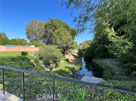 863 Ronda Mendoza, Unit B Laguna Woods, CA 92637 - Photo 37 of 37 a view of a yard with a tree in the background