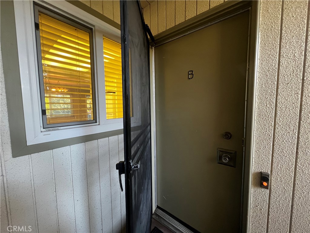 863 Ronda Mendoza, Unit B Laguna Woods, CA 92637 - Photo 5 of 37 a bathroom with a window and a shower