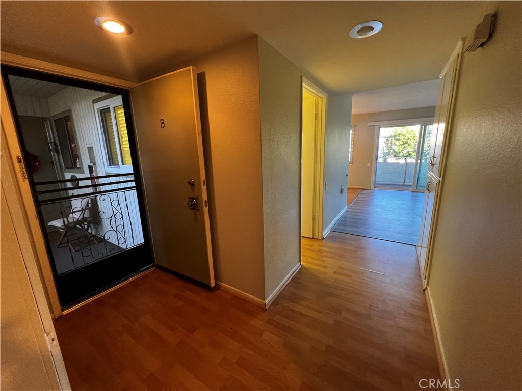 863 Ronda Mendoza, Unit B Laguna Woods, CA 92637 - Photo 8 of 37 a view of a hallway with wooden floor