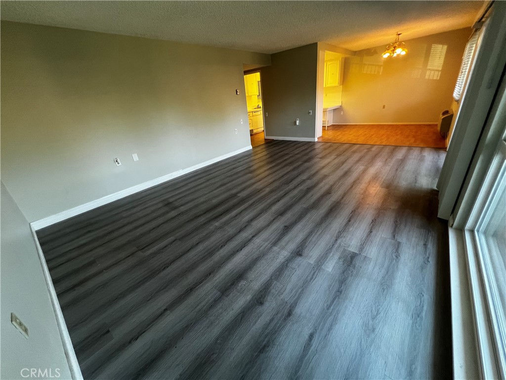 863 Ronda Mendoza, Unit B Laguna Woods, CA 92637 - Photo 10 of 37 a view of empty room with wooden floor
