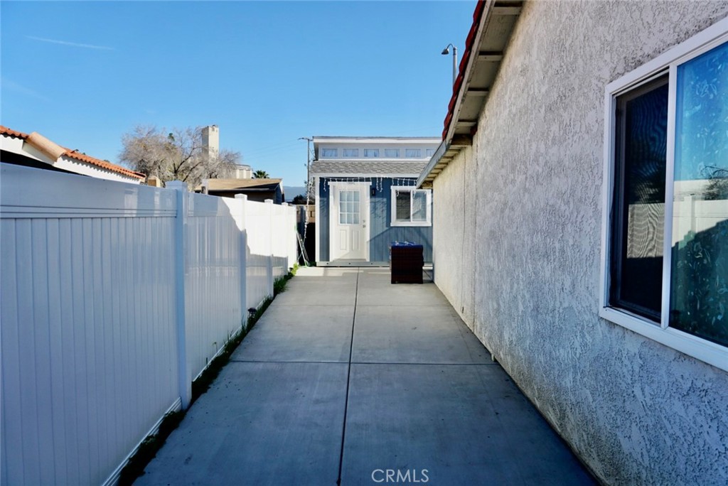 776 Atchison Street Colton, CA 92324 - Photo 6 of 17 Pathway to backyard shed (on the right side of the home)