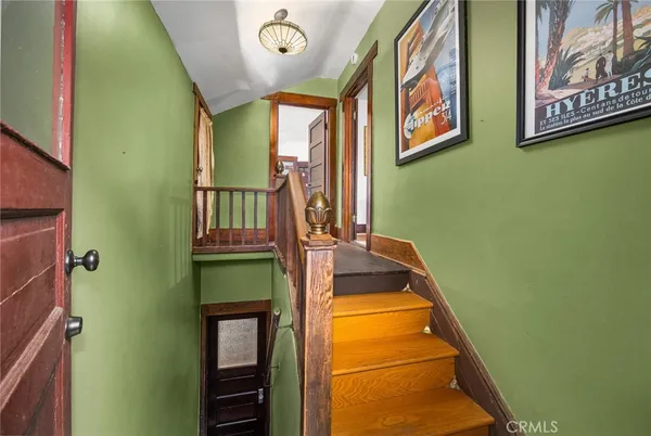 a dining room with furniture and a chandelier