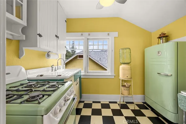 a living room with furniture potted plant and a window