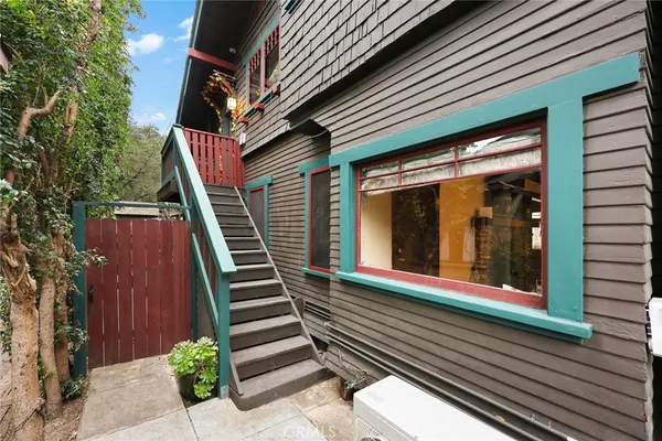 a bathroom with a sink vanity granite toilet and a mirror