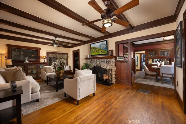 a living room with furniture or couch and a chandelier
