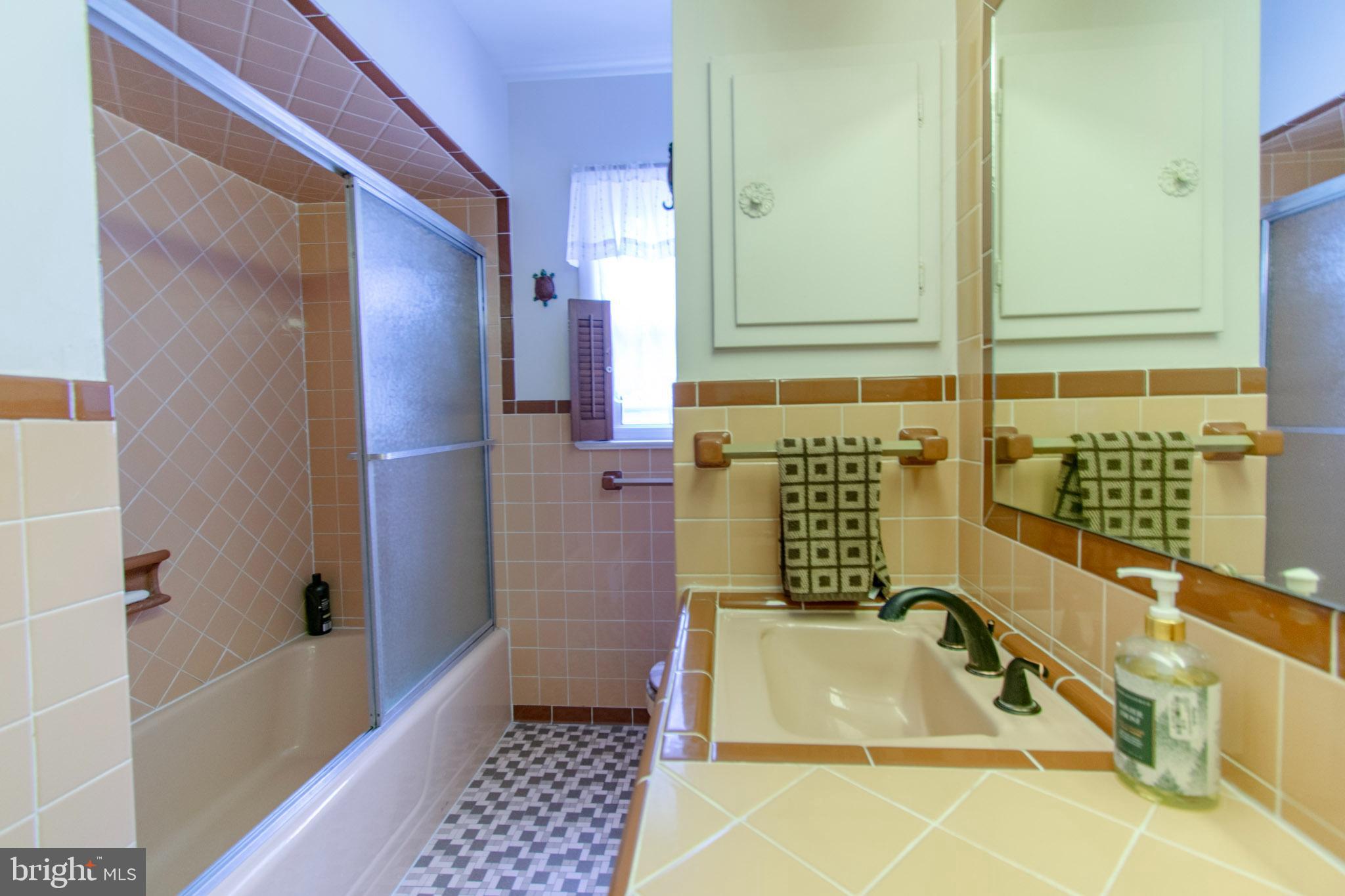 2 Nanticoke Road Cambridge, MD 21613 - Photo 29 of 37 Charming vintage bathroom with retro tiles.