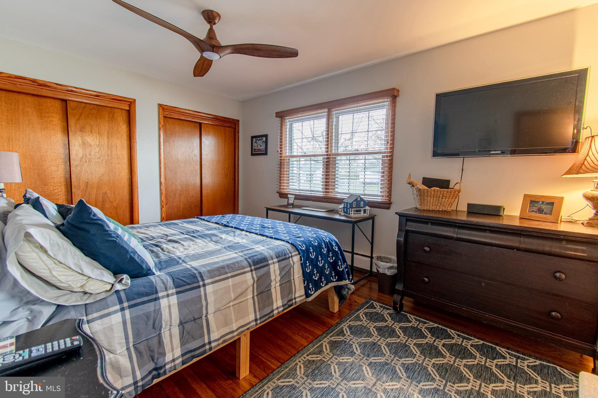 2 Nanticoke Road Cambridge, MD 21613 - Photo 30 of 37 Cozy bedroom with warm wooden accents.
